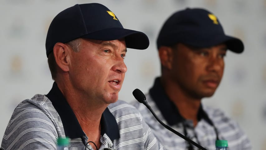 JERSEY CITY, NJ - SEPTEMBER 27:  Captain's assistant Davis Love III of the U.S. Team and Captain's assistant Tiger Woods of the U.S. Team attend a press conference during practice rounds prior to the Presidents Cup at Liberty National Golf Club on September 27, 2017 in Jersey City, New Jersey.  (Photo by Elsa/Getty Images)