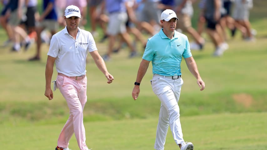 MEMPHIS, TENNESSEE - AUGUST 08: Justin Thomas (L) and Rory McIlroy of Northern Ireland walk across the first hole during the final round of the FedEx St. Jude Invitational at TPC Southwind on August 08, 2021 in Memphis, Tennessee. (Photo by Sam Greenwood/Getty Images)