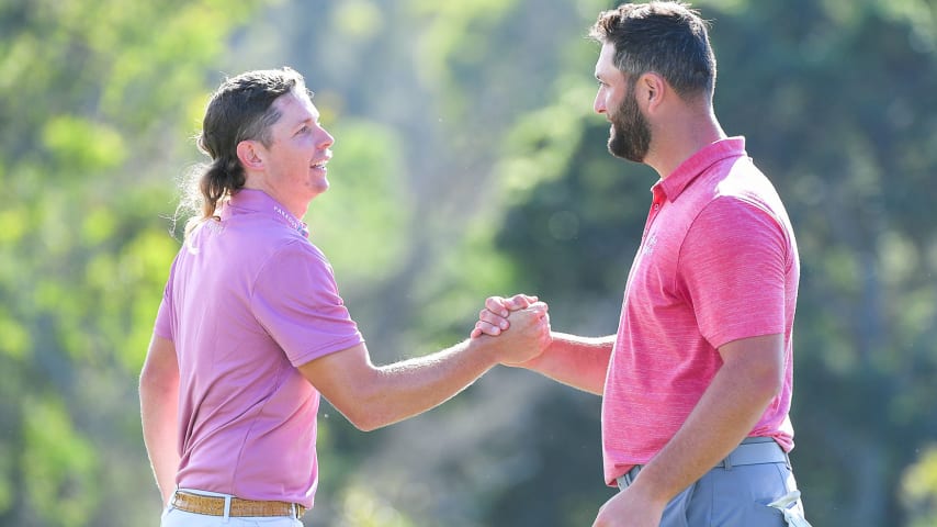 KAPALUA, MAUI - HI - JANUARY 09: Cameron Smith of Australia and Jon Rahm of Spain shake hands on the 18th green during the final round of the Sentry Tournament of Champions on the Plantation Course at Kapalua on January 9, 2022 in Kapalua, Maui, Hawaii. (Photo by Ben Jared/PGA TOUR via Getty Images)