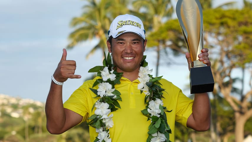 HONOLULU, HAWAII - JANUARY 16: Hideki Matsuyama of Japan celebrates with the trophy after winning in a one-hole playoff against Russell Henley (not pictured) of the United States during the final round of the Sony Open in Hawaii at Waialae Country Club on January 16, 2022 in Honolulu, Hawaii. (Photo by Gregory Shamus/Getty Images)