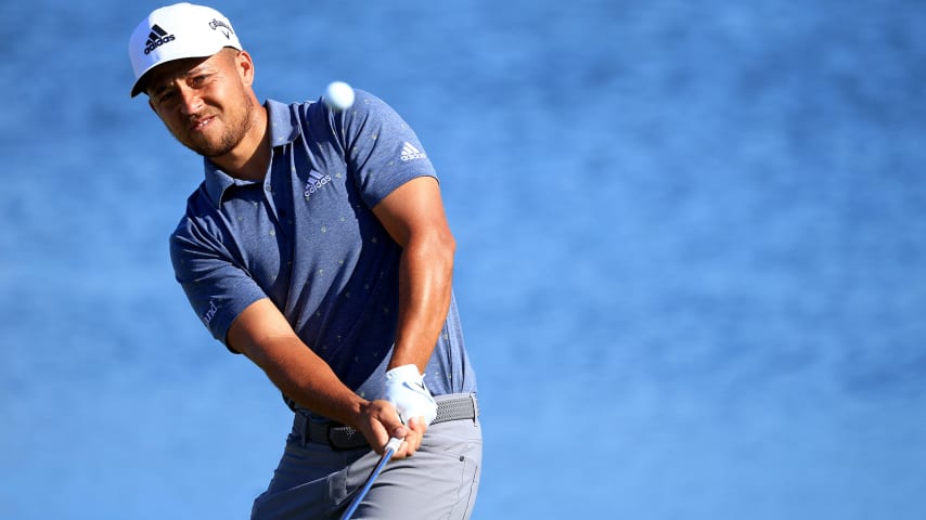 NASSAU, BAHAMAS - DECEMBER 02: Xander Schauffele of the United States chips on the ninth hole during the first round of the Hero World Challenge at Albany Golf Course on December 02, 2021 in Nassau, . (Photo by Mike Ehrmann/Getty Images)