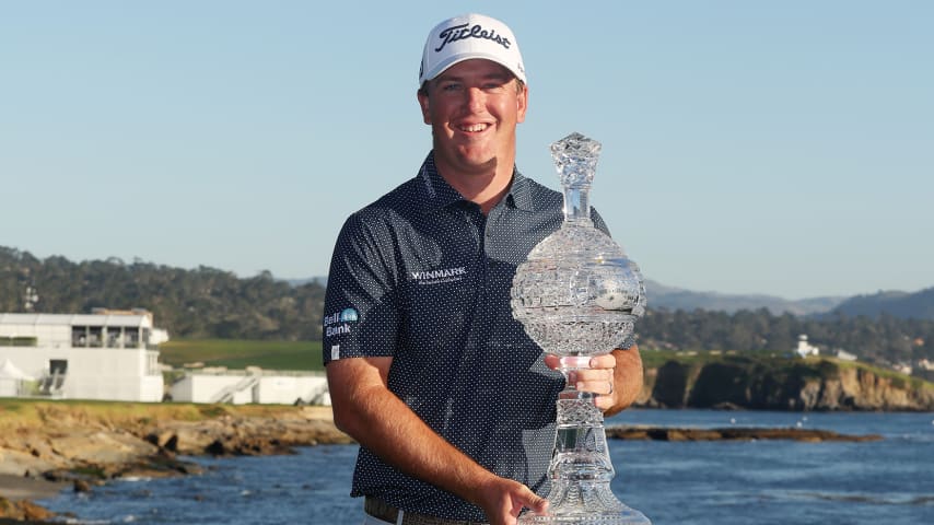 PEBBLE BEACH, CALIFORNIA - FEBRUARY 06: Tom Hoge of the United States celebrates with the trophy after winning during the final round of the AT&T Pebble Beach Pro-Am at Pebble Beach Golf Links on February 06, 2022 in Pebble Beach, California. (Photo by Jamie Squire/Getty Images)