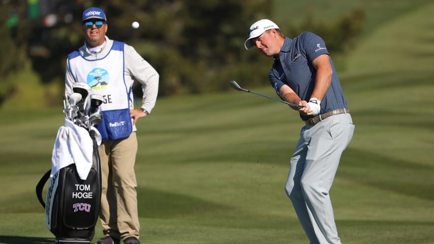 PEBBLE BEACH, CALIFORNIA - FEBRUARY 06: Tom Hoge of the United States plays his third shot on the sixth hole during the final round of the AT&T Pebble Beach Pro-Am at Pebble Beach Golf Links on February 06, 2022 in Pebble Beach, California. (Photo by Jamie Squire/Getty Images)