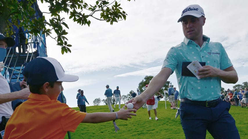 LA JOLLA, CALIFORNIA - JANUARY 28: Justin Thomas gives his ball to a fan after the sixth hole during the third round of The Farmers Insurance Open on the South Course at Torrey Pines Golf Course on January 28, 2022 in La Jolla, California. (Photo by Donald Miralle/Getty Images)