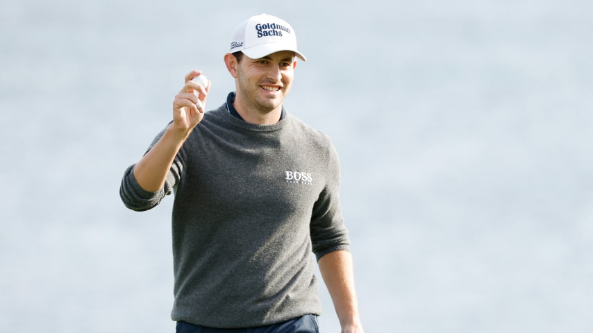 PEBBLE BEACH, CALIFORNIA - FEBRUARY 05: Patrick Cantlay of the United States waves on the 18th green during the third round of the AT&T Pebble Beach Pro-Am at Pebble Beach Golf Links on February 05, 2022 in Pebble Beach, California. (Photo by Cliff Hawkins/Getty Images)