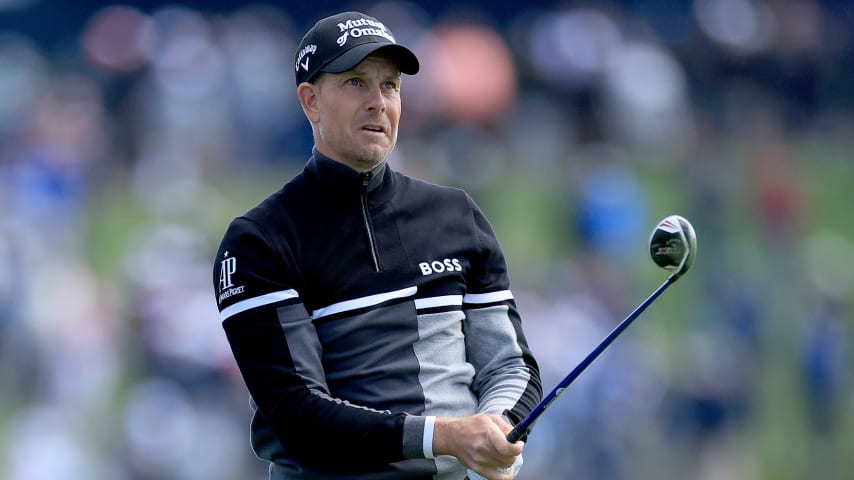 PONTE VEDRA BEACH, FLORIDA - MARCH 12: Henrik Stenson of Sweden plays his second shot on the par 4, 18th hole during the rain delayed completion of the first round of THE PLAYERS Championship at TPC Sawgrass on March 12, 2022 in Ponte Vedra Beach, Florida. (Photo by David Cannon/Getty Images)
