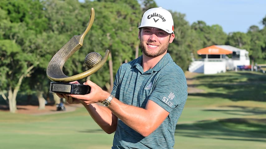 PALM HARBOR, FLORIDA - MAY 02: Sam Burns of the United States celebrates with the trophy after winning during the final round of the Valspar Championship on the Copperhead Course at Innisbrook Resort on May 02, 2021 in Palm Harbor, Florida. (Photo by Julio Aguilar/Getty Images)