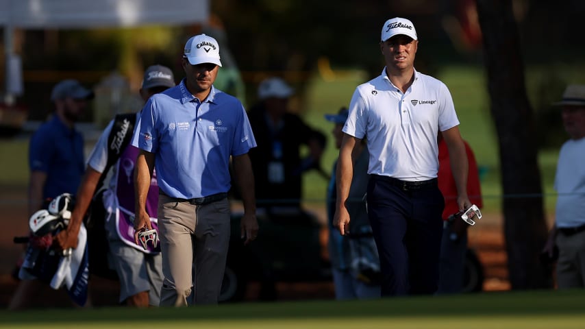 PALM HARBOR, FLORIDA - MARCH 18: (L-R) Kevin Kisner of the United States and Justin Thomas of the United States walk the 13th hole during the second round of the Valspar Championship on the Copperhead Course at Innisbrook Resort and Golf Club on March 18, 2022 in Palm Harbor, Florida. (Photo by Douglas P. DeFelice/Getty Images)