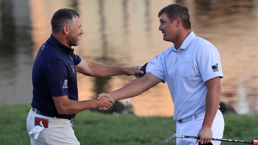 ORLANDO, FLORIDA - MARCH 07: Lee Westwood (L) of England congratulates Bryson DeChambeau (R) of the United States on the 18th green after DeChambeau won during the final round of the Arnold Palmer Invitational Presented by MasterCard at the Bay Hill Club and Lodge on March 07, 2021 in Orlando, Florida. (Photo by Sam Greenwood/Getty Images)