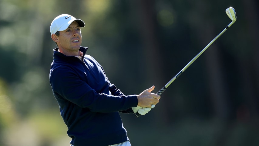 PONTE VEDRA BEACH, FLORIDA - MARCH 13: Rory McIlroy of Northern Ireland plays his second shot on the par 4, 10th hole during completion of the weather delayed third round of THE PLAYERS Championship at TPC Sawgrass on March 13, 2022 in Ponte Vedra Beach, Florida. (Photo by David Cannon/Getty Images)