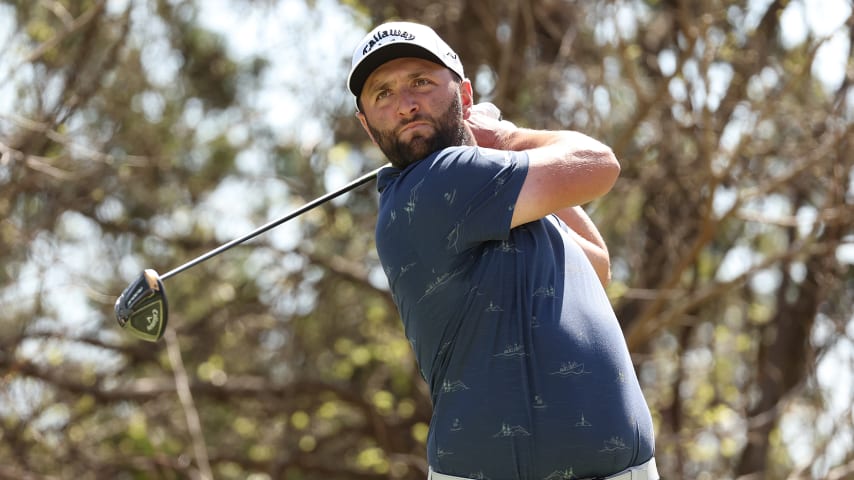 AUSTIN, TEXAS - MARCH 26: Jon Rahm of Spain plays his shot from the 18th tee in his Round of 16 match against Brooks Koepka of the United States on the fourth day of the World Golf Championships-Dell Technologies Match Play at Austin Country Club on March 26, 2022 in Austin, Texas. (Photo by Gregory Shamus/Getty Images)