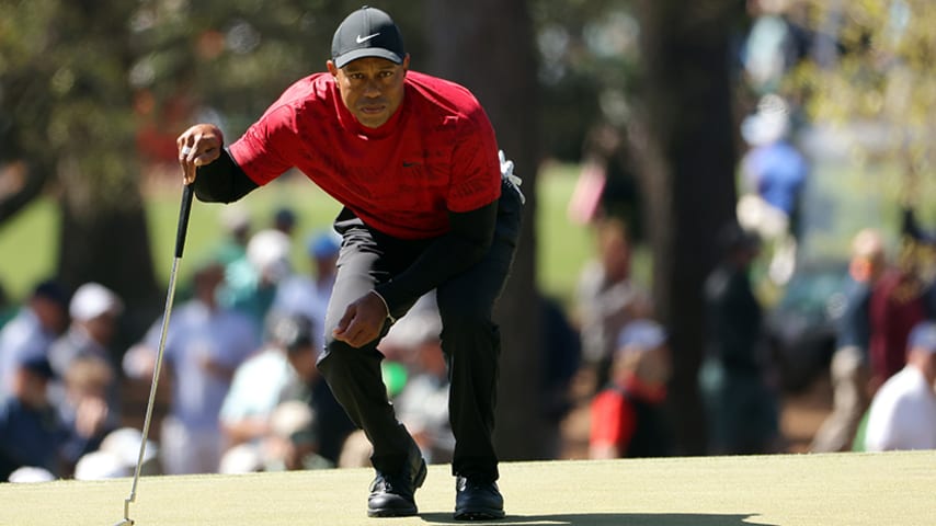 AUGUSTA, GEORGIA - APRIL 10: Tiger Woods lines up a putt on the third green during the final round of the Masters at Augusta National Golf Club on April 10, 2022 in Augusta, Georgia. (Photo by Jamie Squire/Getty Images)