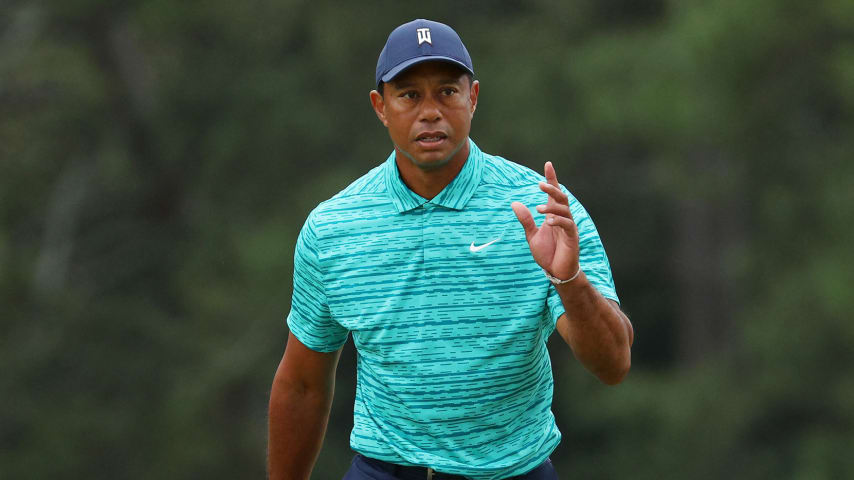 AUGUSTA, GEORGIA - APRIL 08: Tiger Woods waves to the crowd as he walks to the 18th green during the second round of The Masters at Augusta National Golf Club on April 08, 2022 in Augusta, Georgia. (Photo by Andrew Redington/Getty Images)