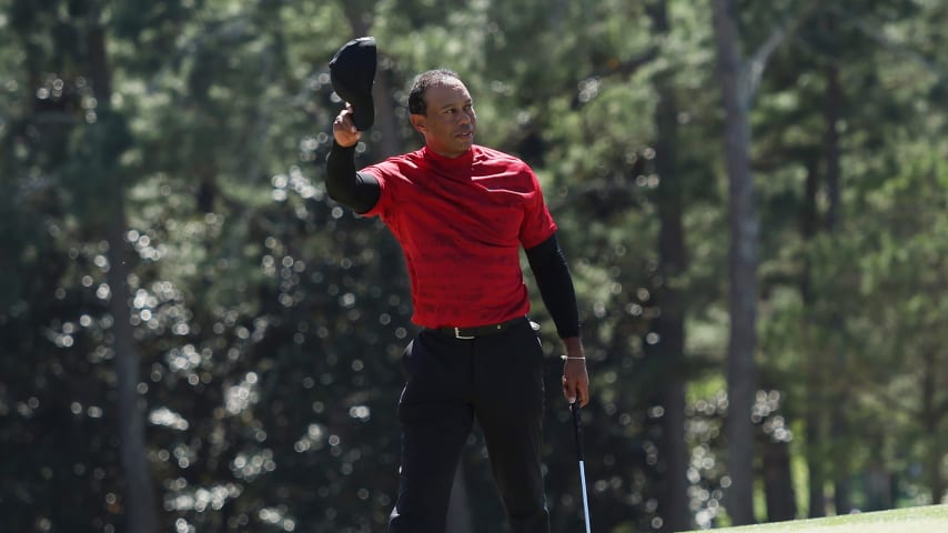 AUGUSTA, GEORGIA - APRIL 10: Tiger Woods tips his hat to the crowd on the 18th green after finishing his round during the final round of the Masters at Augusta National Golf Club on April 10, 2022 in Augusta, Georgia. (Photo by Gregory Shamus/Getty Images)