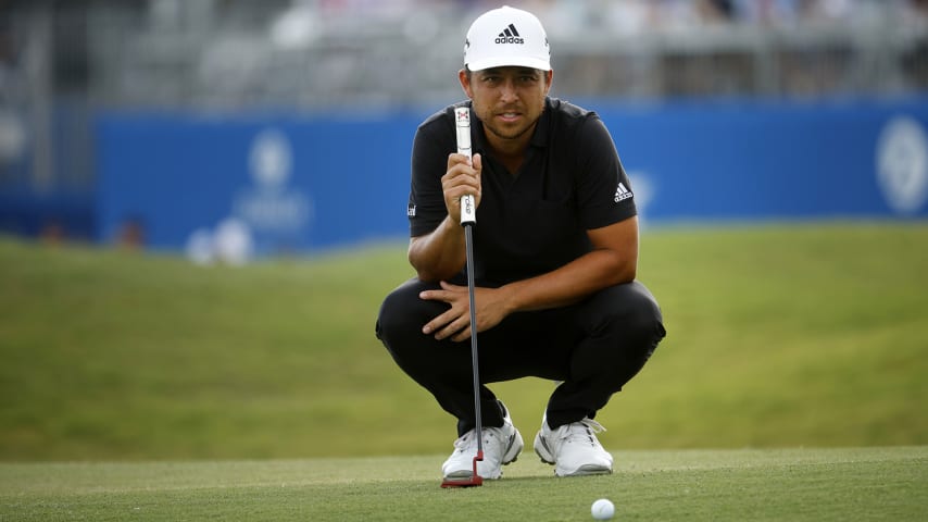 AVONDALE, LOUISIANA - APRIL 24: Xander Schauffele lines up a putt on the 18th green during the final round of the Zurich Classic of New Orleans at TPC Louisiana on April 24, 2022 in Avondale, Louisiana. (Photo by Chris Graythen/Getty Images)