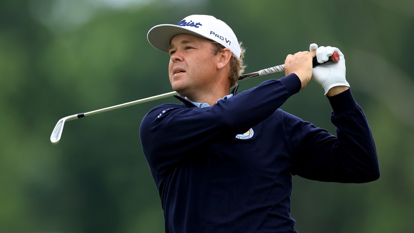 TULSA, OKLAHOMA - MAY 22: Patton Kizzire of The United States plays his second shot on the 18th hole during the final round of the 2022 PGA Championship at Southern Hills Country Club on May 22, 2022 in Tulsa, Oklahoma. (Photo by David Cannon/Getty Images)