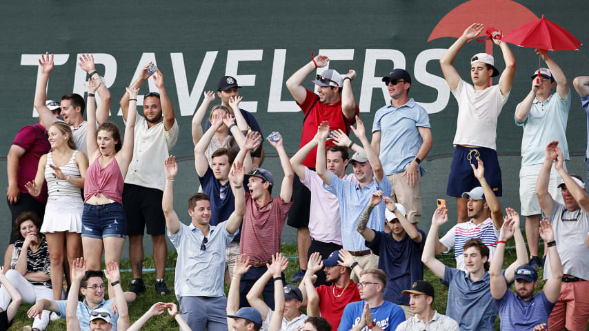 CROMWELL, CONNECTICUT - JUNE 27: Fans do the wave during the seventh playoff hole between Kramer Hickok of the United States and Harris English of the United States during the final round of the Travelers Championship at TPC River Highlands on June 27, 2021 in Cromwell, Connecticut. (Photo by Michael Reaves/Getty Images)