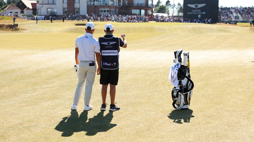 NORTH BERWICK, SCOTLAND - JULY 10:  Xander Schauffele of the United States talks with his caddie Austin Kaiser on the fifth hole during Day Four of the Genesis Scottish Open at The Renaissance Club on July 10, 2022 in North Berwick, Scotland. (Photo by Andrew Redington/Getty Images)