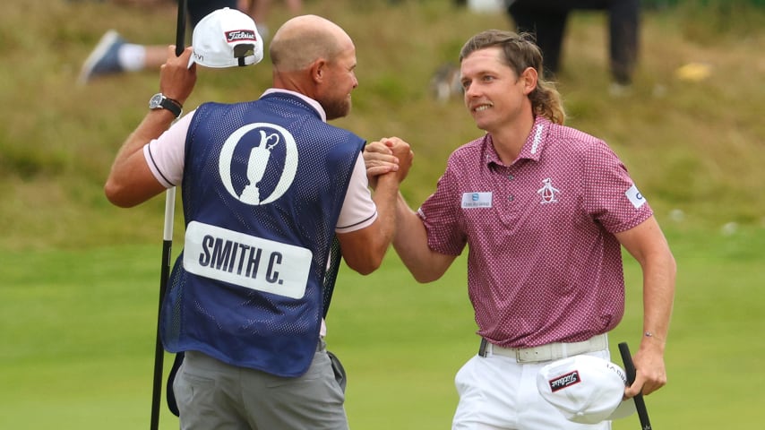 ST ANDREWS, SCOTLAND - JULY 17: Cameron Smith of Australia celebrates with caddie Sam Pinfold on the 18th green during Day Four of The 150th Open at St Andrews Old Course on July 17, 2022 in St Andrews, Scotland. (Photo by Andrew Redington/Getty Images)