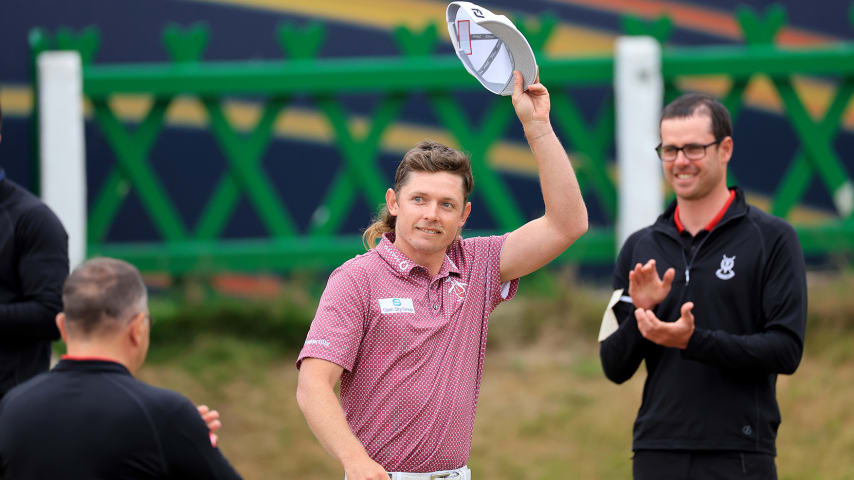 ST ANDREWS, SCOTLAND - JULY 17: Cameron Smith of Australia walks past the green keepers guard of honour on his way to being presented with the Claret Jug after his victory in the final round of The 150th Open on The Old Course at St Andrews on July 17, 2022 in St Andrews, Scotland. (Photo by David Cannon/Getty Images)