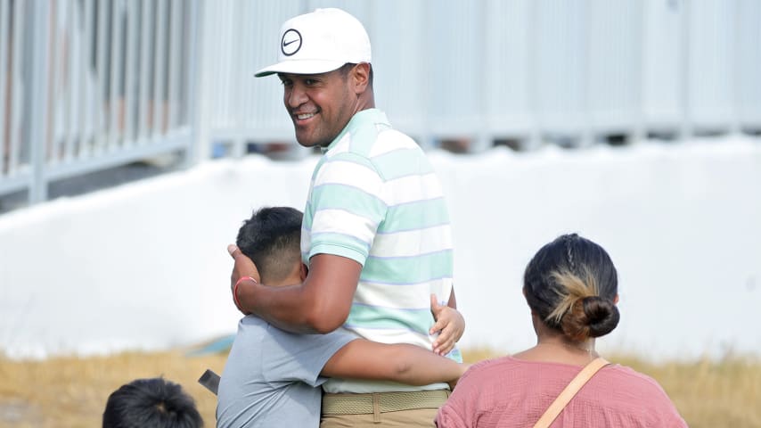 Tony Finau celebrates with his family after winning the 3M Open at TPC Twin Cities. (Stacy Revere/Getty Images)