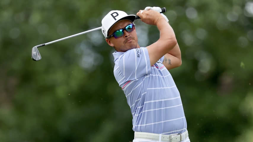 DETROIT, MICHIGAN - JULY 29: Rickie Fowler of the United States plays his shot from the ninth tee during the second round of the Rocket Mortgage Classic at Detroit Golf Club on July 29, 2022 in Detroit, Michigan. (Photo by Gregory Shamus/Getty Images)