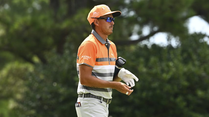 MEMPHIS, TENNESSEE - AUGUST 14: Rickie Fowler removes his glove while leaving the 17th hole during the final round of the FedEx St. Jude Championship at TPC Southwind on August 14, 2022 in Memphis, Tennessee. (Photo by Tracy Wilcox/PGA TOUR via Getty Images)