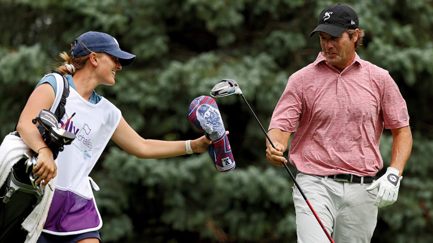 GRAND BLANC, MICHIGAN - AUGUST 28: Mario Tiziani of the United States and his caddie and niece Bobbi Stricker laugh after Tiziani's tee shot on the second hole during the final round of The Ally Challenge at Warwick Hills Golf And Country Club on August 28, 2022 in Grand Blanc, Michigan. (Photo by Mike Mulholland/Getty Images)
