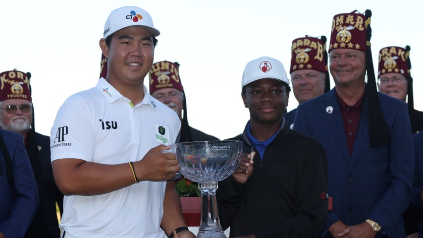 LAS VEGAS, NEVADA - OCTOBER 09: Tom Kim of South Korea poses with the trophy after winning the Shriners Children's Open at TPC Summerlin on October 09, 2022 in Las Vegas, Nevada. (Photo by Jed Jacobsohn/Getty Images)