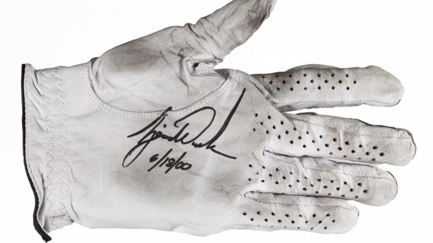 Items signed by Tiger Woods go up for auction