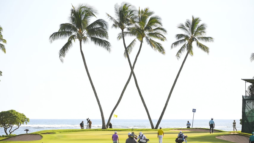 HONOLULU, HI - JANUARY 16: Hideki Matsuyama of Japan and Russell Henley walk with their caddies towards the 16th green during the final round of the Sony Open in Hawaii at Waialae Country Club on January 16, 2022 in Honolulu, Hawaii. (Photo by Ben Jared/PGA TOUR via Getty Images)