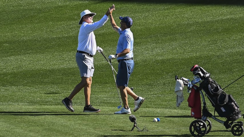 Two friends celebrate after one landed safely on the 17th hole green on the Stadium Course at TPC Sawgrass, home of THE PLAYERS Championship, on January 20, 2023 in Ponte Vedra Beach, Florida. (Photo by Keyur Khamar/PGA TOUR via Getty Images)