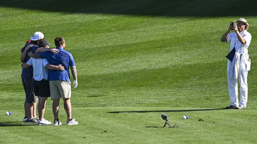 A caddie takes a photo of a foursome on the 17th hole tee on the Stadium Course at TPC Sawgrass, home of THE PLAYERS Championship, on January 20, 2023 in Ponte Vedra Beach, Florida. (Photo by Keyur Khamar/PGA TOUR via Getty Images)