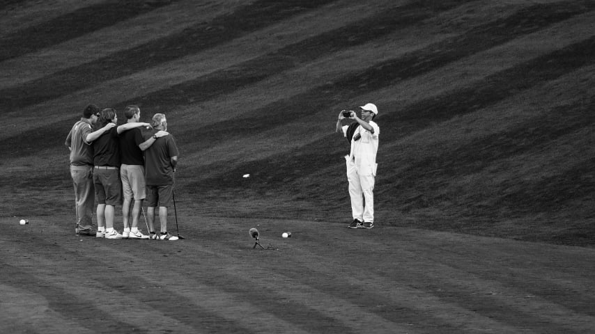 A caddie takes a photo of a foursome on the 17th hole on the Stadium Course at TPC Sawgrass, home of THE PLAYERS Championship, on January 20, 2023 in Ponte Vedra Beach, Florida. (Photo by Keyur Khamar/PGA TOUR via Getty Images)