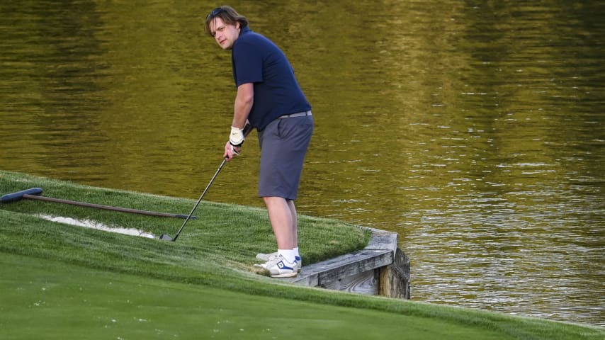 A golfer stands on the bulkhead before playing a shot on the 17th hole on the Stadium Course at TPC Sawgrass, home of THE PLAYERS Championship, on January 20, 2023 in Ponte Vedra Beach, Florida. (Photo by Keyur Khamar/PGA TOUR via Getty Images)