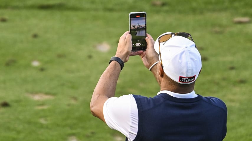 A golfer takes a picture on the 17th hole on the Stadium Course at TPC Sawgrass, home of THE PLAYERS Championship, on January 20, 2023 in Ponte Vedra Beach, Florida. (Photo by Keyur Khamar/PGA TOUR via Getty Images)