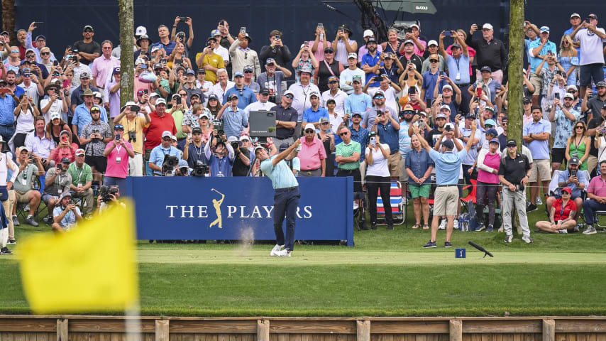 PONTE VEDRA BEACH, FLORIDA - MARCH 12:  Scottie Scheffler plays his shot from the 17th tee as fans watch during the final round of THE PLAYERS Championship on the Stadium Course at TPC Sawgrass on March 12, 2023 in Ponte Vedra Beach, Florida. (Photo by Keyur KhamarPGA TOUR via Getty Images)