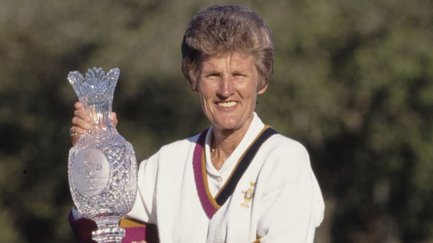 Kathy Whitworth, Team Captain for the United States holds the trophy aloft after Team USA defeated Europe in the inaugural Solheim Cup competition golf tournament on 18th November 1990 at the Lake Nona Golf & Country Club in Orlando, Florida, United States. (Photo by David Cannon/Allsport/Getty Images)