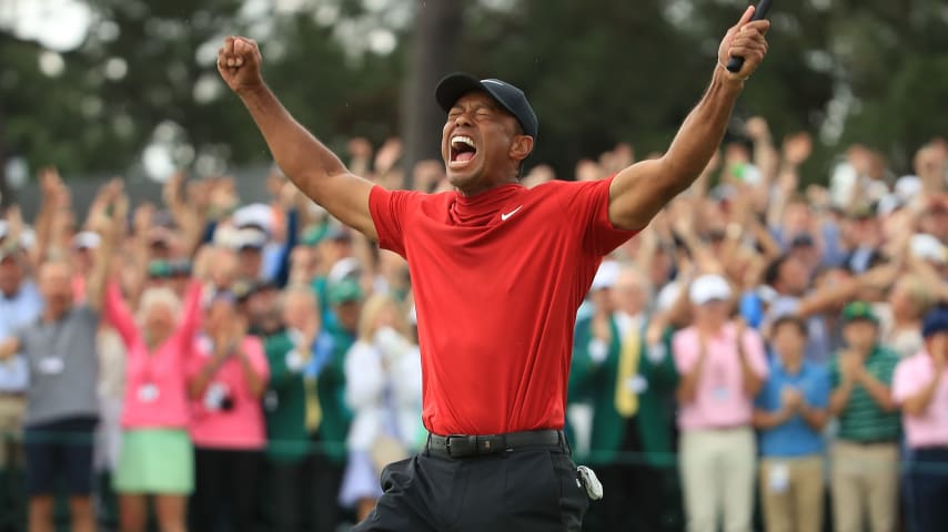 AUGUSTA, GEORGIA - APRIL 14: Tiger Woods of the United States celebrates on the 18th green after winning the Masters at Augusta National Golf Club on April 14, 2019 in Augusta, Georgia. (Photo by Andrew Redington/Getty Images)