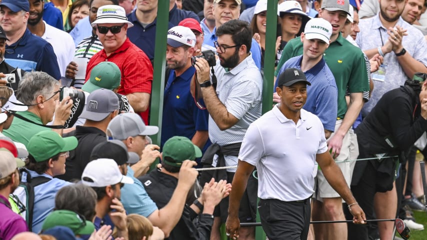 AUGUSTA, GA - APRIL 06:  Tiger Woods walks past patrons lining the walkway to the 18th hole during practice for the Masters at Augusta National Golf Club on April 6, 2022, in Augusta, Georgia. (Photo by Keyur Khamar/PGA TOUR via Getty Images)