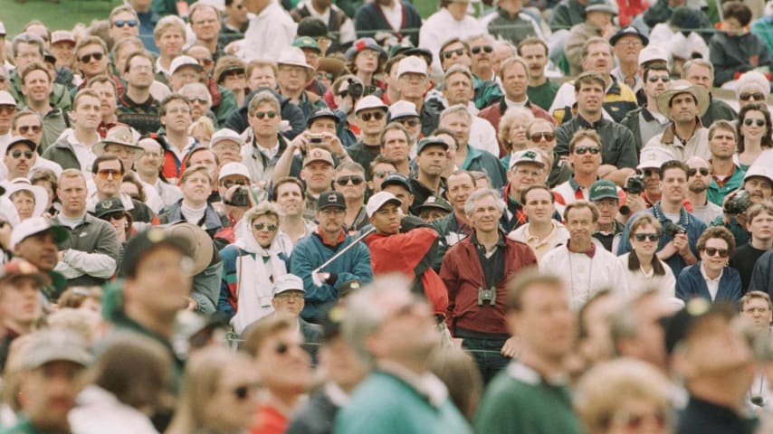 9 Apr 1996:  Tiger Woods of the USA watches for the result of his tee shot from the third hole amidst a massive crowd of spectators during today's practice round for the U.S. Masters golf tournament at the Augusta National Golf Club in Augusta, Georgia.Mandatory Credit: David Cannon/Allsport