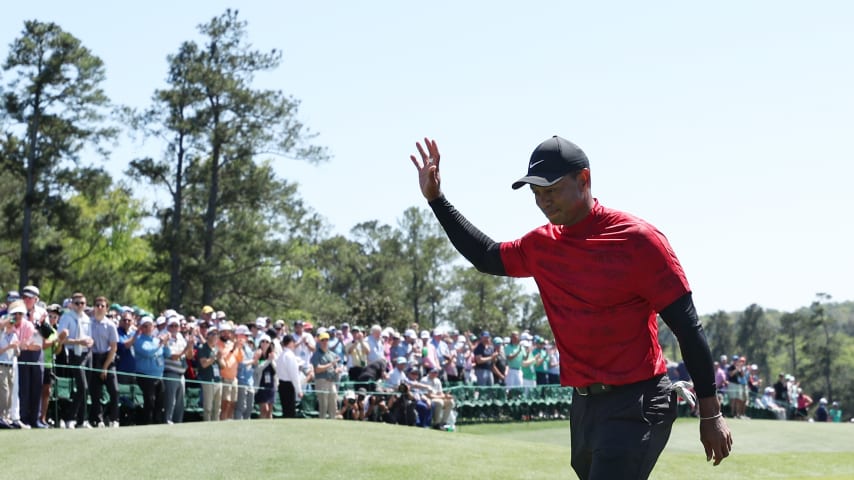 AUGUSTA, GEORGIA - APRIL 10: Tiger Woods waves to the crowd on the 18th green after finishing his round during the final round of the Masters at Augusta National Golf Club on April 10, 2022 in Augusta, Georgia. (Photo by Gregory Shamus/Getty Images)