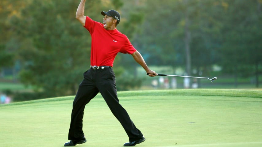 AUGUSTA, GA - APRIL 10:  Tiger Woods celebrates after sinking a putt on the first playoff hole to win the 2005 Masters on April 10, 2005 at Augusta National Golf Course in Augusta, Georgia.  (Photo By Getty Images)