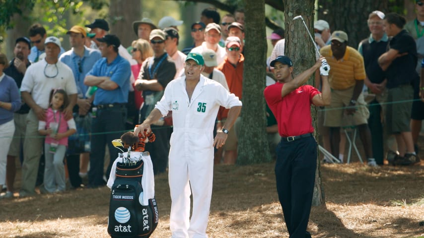 AUGUSTA, GA - APRIL 12:  Tiger Woods prepares to a play a shot on the ninth hole as his caddie Steve Williams looks on during the final round of the 2009 Masters Tournament at Augusta National Golf Club on April 12, 2009 in Augusta, Georgia.  (Photo by Jamie Squire/Getty Images)