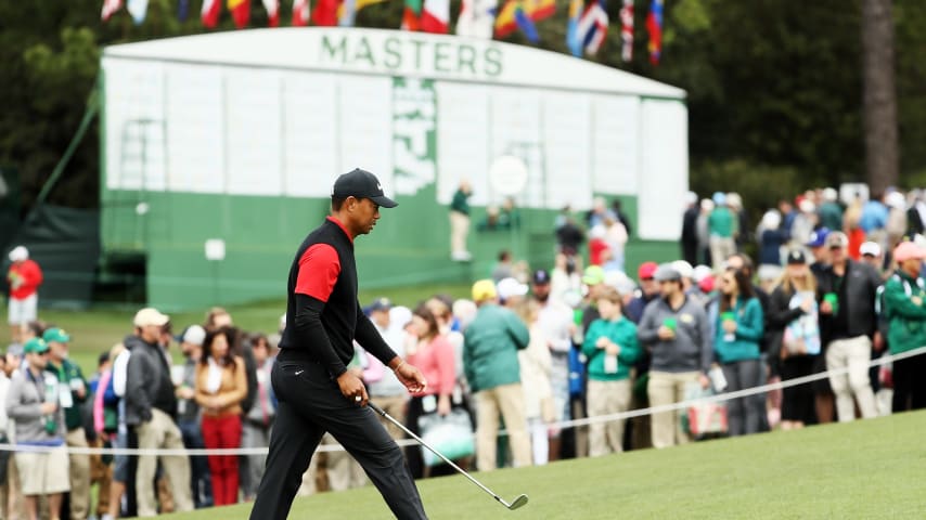 AUGUSTA, GA - APRIL 08:  Tiger Woods of the United States walks up the ninth fairway passing the main leaderboard during the final round of the 2018 Masters Tournament at Augusta National Golf Club on April 8, 2018 in Augusta, Georgia.  (Photo by Jamie Squire/Getty Images)