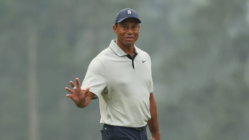 AUGUSTA, GEORGIA - APRIL 04: Tiger Woods of the United States waves on the third green during a practice round prior to the 2023 Masters Tournament at Augusta National Golf Club on April 04, 2023 in Augusta, Georgia. (Photo by Patrick Smith/Getty Images)