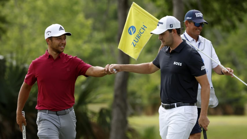 AVONDALE, LOUISIANA - APRIL 23: Xander Schauffele and Patrick Cantlay react after a putt on the 15th green during the third round of the Zurich Classic of New Orleans at TPC Louisiana on April 23, 2022 in Avondale, Louisiana. (Photo by Chris Graythen/Getty Images)