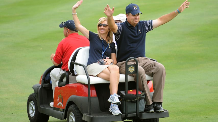 Kenny Perry of the USA team and his wife Sandy ride on a cart during the 2008 Ryder Cup at Valhalla Golf Club. (Harry How/Getty Images)