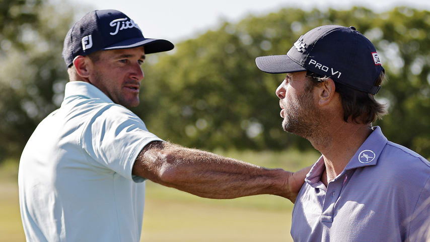 ARLINGTON, TEXAS - APRIL 16: Spencer Levin (C) of the United States is congratulated by Sam Saunders of the United States after winning the Veritex Bank Championship at Texas Rangers Golf Club on April 16, 2023 in Arlington, Texas. (Photo by Mike Mulholland/Getty Images)