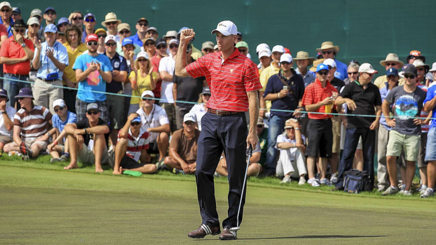 MELBOURNE, AUSTRALIA - NOVEMBER 18: Jim Furyk of the U.S. Team celebrates making birdie to win the match on the 17th hole during the Day Two Four-Ball Matches of the 2011 Presidents Cup at Royal Melbourne Golf Course on November 18, 2011 in Melbourne, Australia.  (Photo by Scott Halleran/Getty Images)